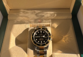 Rolex submariner date gold steal with black dial