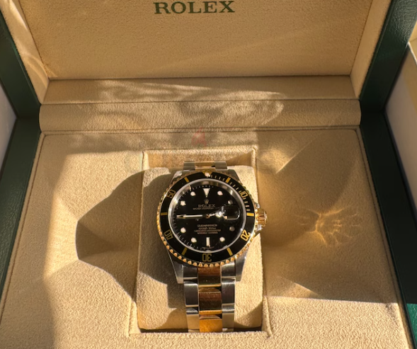 Rolex submariner date gold steal with black dial