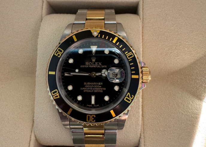 Rolex submariner date gold steal with black dial