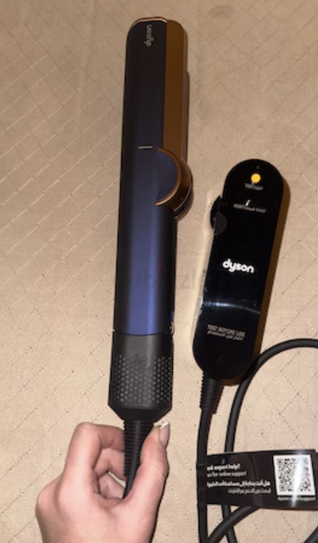 Dyson Airstrait with carrying case.Never used.