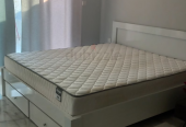 Bed with mattress and wardrobe