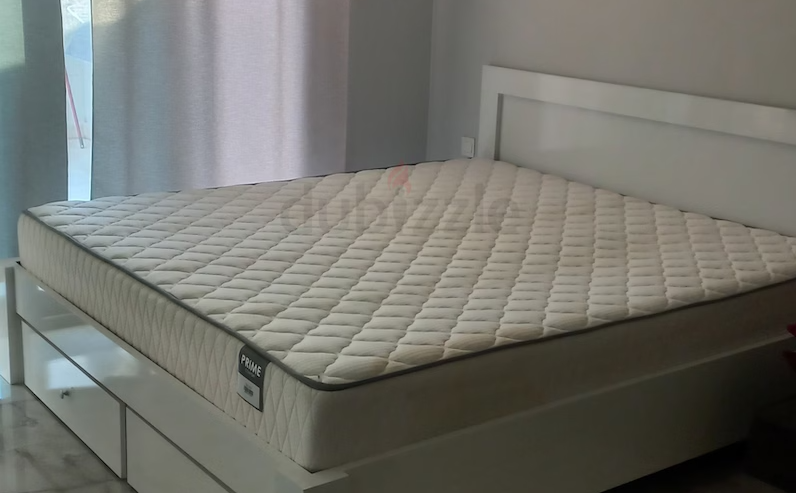 Bed with mattress and wardrobe