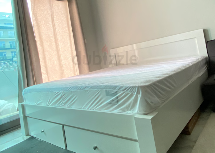 Bed with mattress and wardrobe