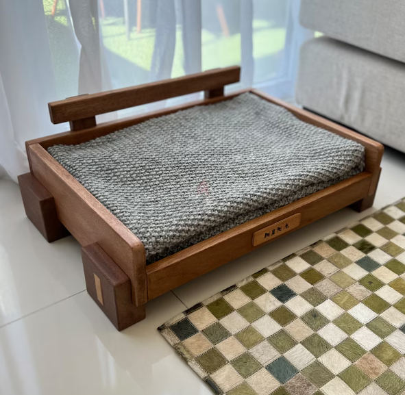Contemporary hard wood pet bed. Brand new.