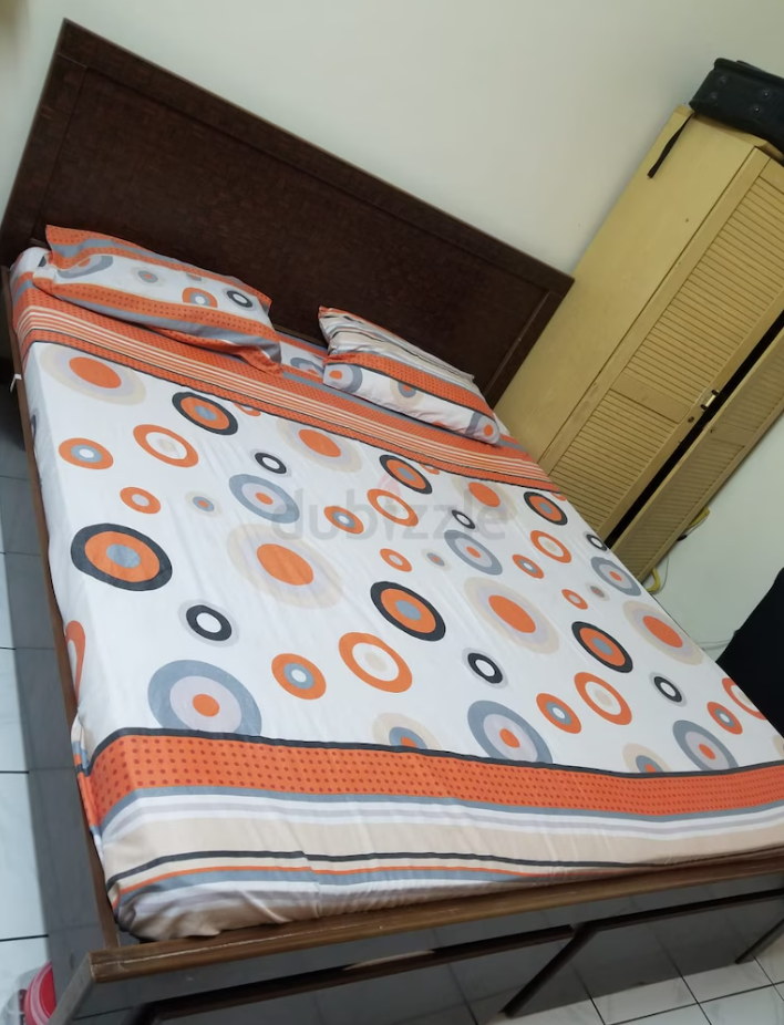 Dark brown double bed with storage