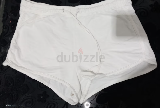 Plain white cotton shorts, size 12