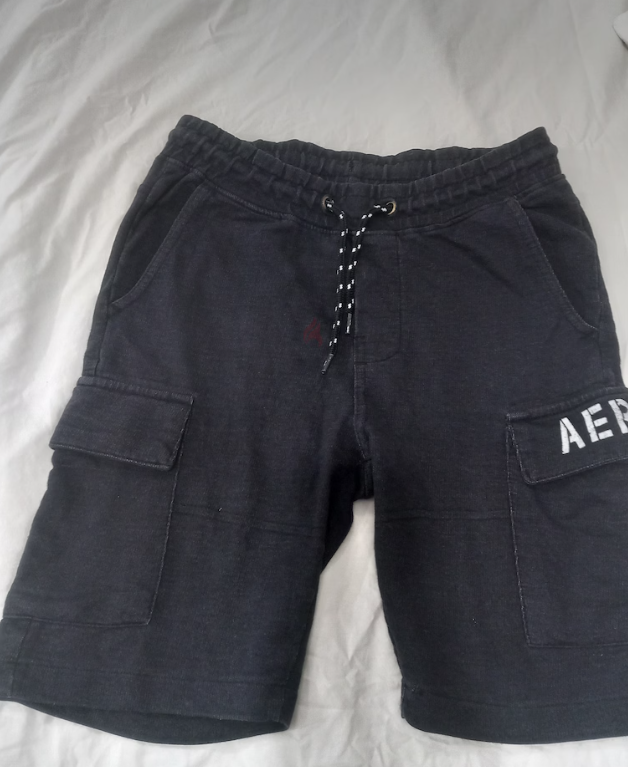 Black cotton shorts for boys, size 8 years