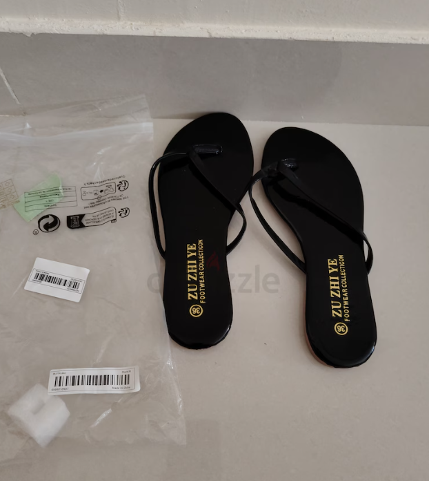 Brand New black slippers Aed 10