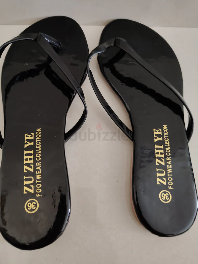 Brand New black slippers Aed 10