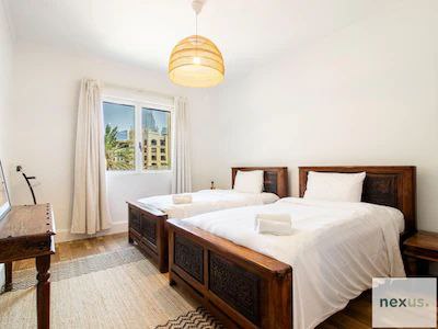 Aesthetics of traditional Arabian village w/ Burj Khalifa views