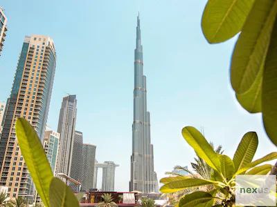 Aesthetics of traditional Arabian village w/ Burj Khalifa views