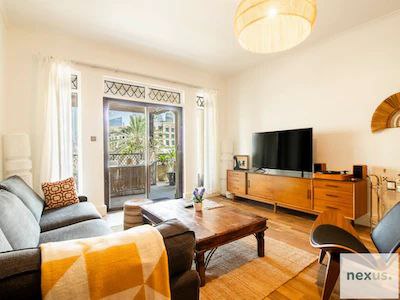 Aesthetics of traditional Arabian village w/ Burj Khalifa views