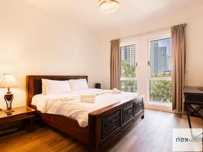 Aesthetics of traditional Arabian village w/ Burj Khalifa views